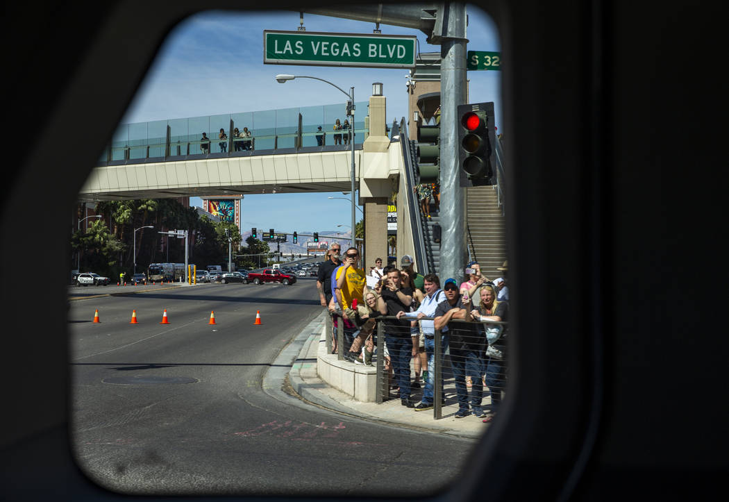 Pedestrians line the street as President Donald J. Trump's motorcade nears The Venetian where h ...