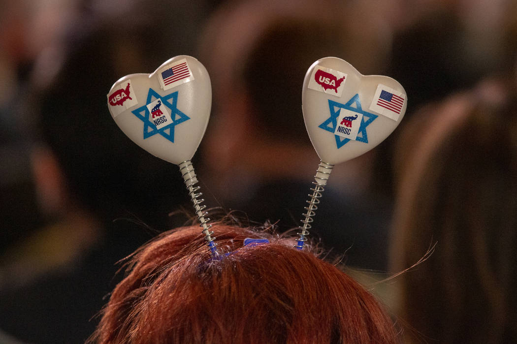 An attendee wears a heart headpiece as President Donald J. Trump addresses the Republican Jewis ...