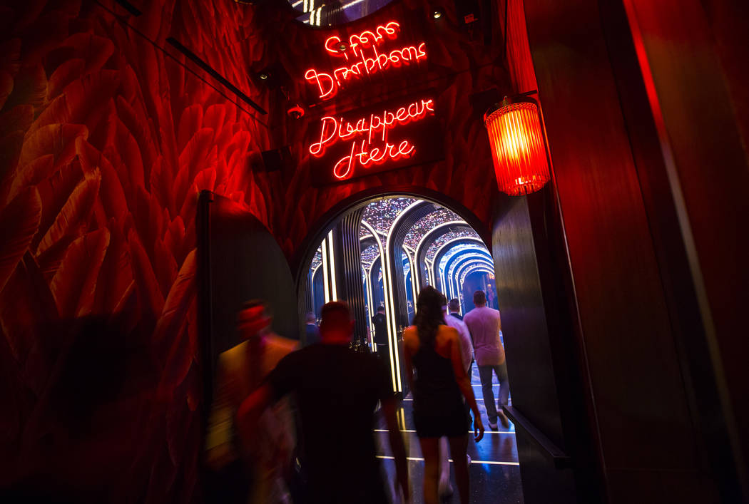 Attendees walk into a mirrored hallway to enter Kaos, the new dayclub and nightclub at the Palm ...