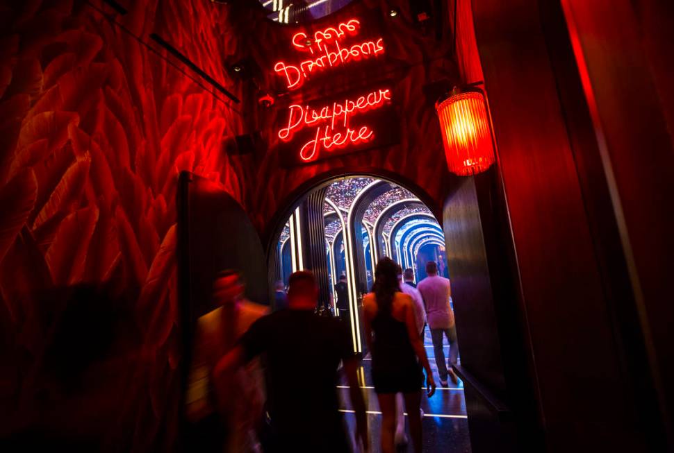 Attendees walk into a mirrored hallway to enter Kaos, the new dayclub and nightclub at the Palm ...