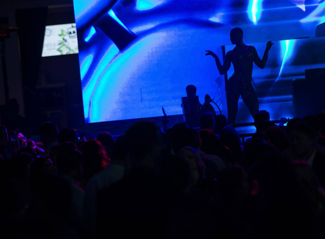 A dancer is silhouetted during the grand opening weekend of Kaos, the new dayclub and nightclub ...