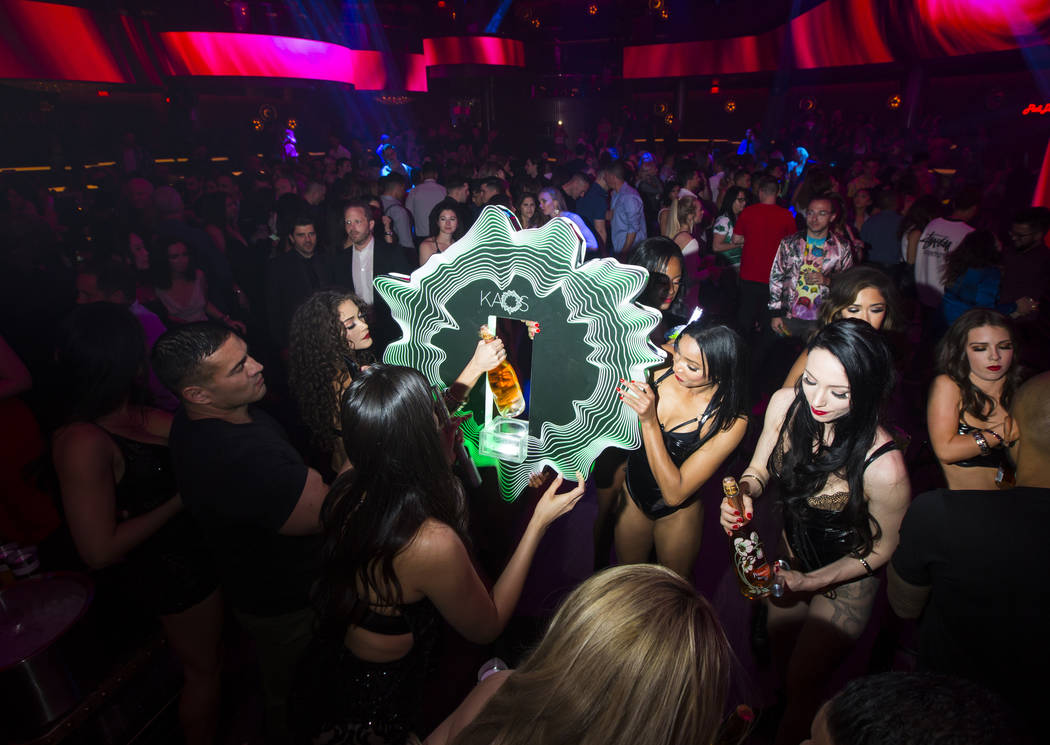 Bottles of champagne are delivered to a table in the nightclub area during the grand opening we ...