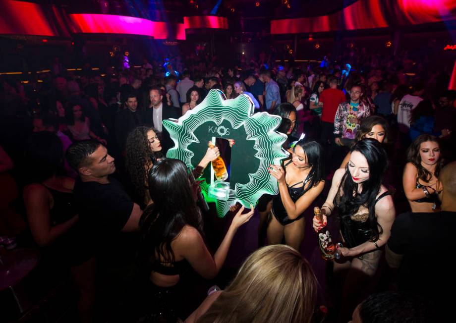 Bottles of champagne are delivered to a table in the nightclub area during the grand opening we ...