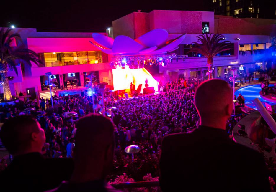 Attendees dance and listen to music during the grand opening weekend of Kaos, the new dayclub a ...