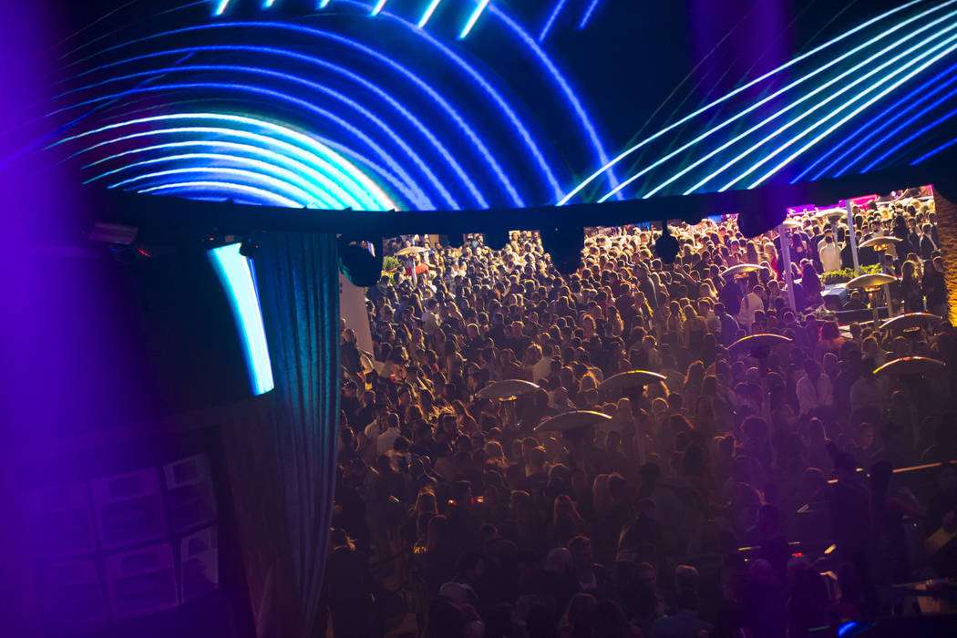 Attendees listen to Saint Jhn around the outdoor area, as seen from the mezzanine in the nightc ...