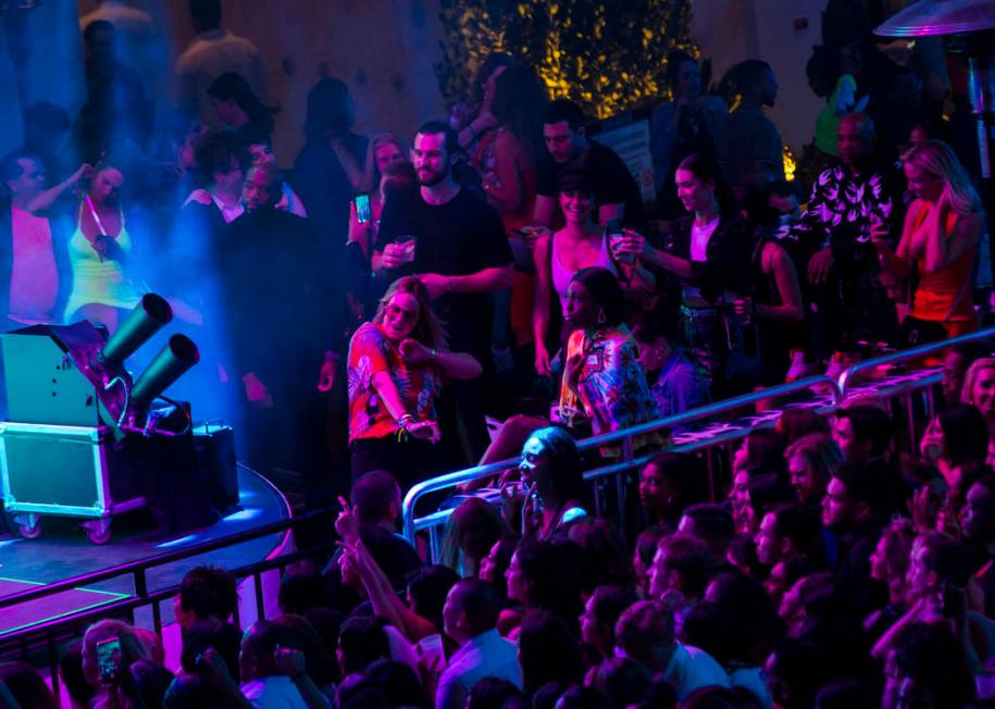 Attendees dance to Saint Jhn around the outdoor area the during the grand opening weekend of Ka ...