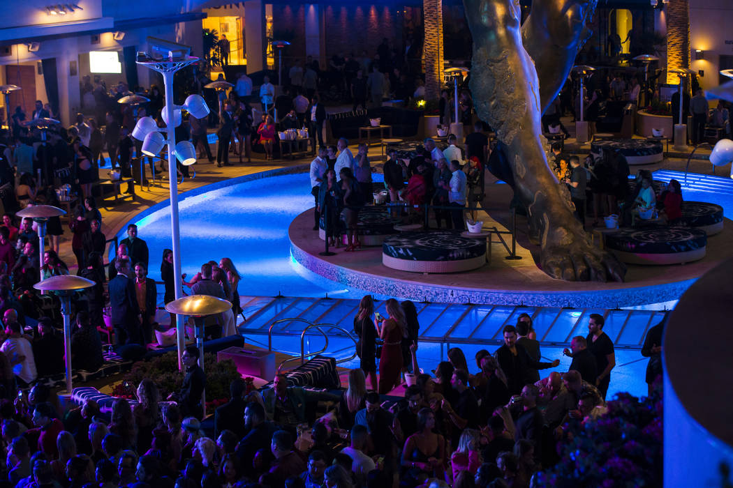 Attendees dance and listen to Saint Jhn around the outdoor area the during the grand opening we ...