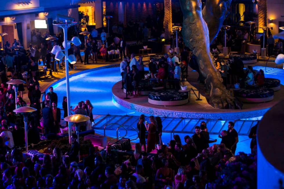 Attendees dance and listen to Saint Jhn around the outdoor area the during the grand opening we ...