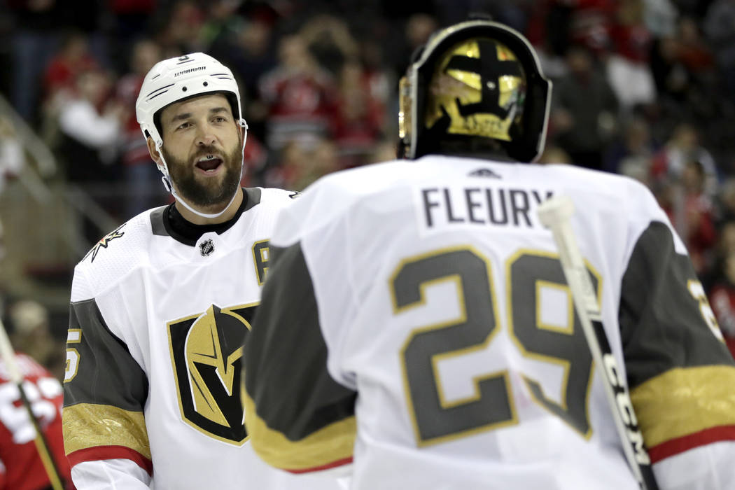 Vegas Golden Knights defenseman Deryk Engelland, left, talks to goaltender Marc-Andre Fleury (2 ...