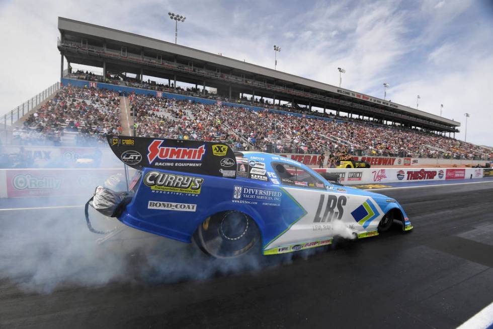 In this photo provided by the NHRA, Tim Wilkerson picks up his first Funny Car No. 1 qualifier ...