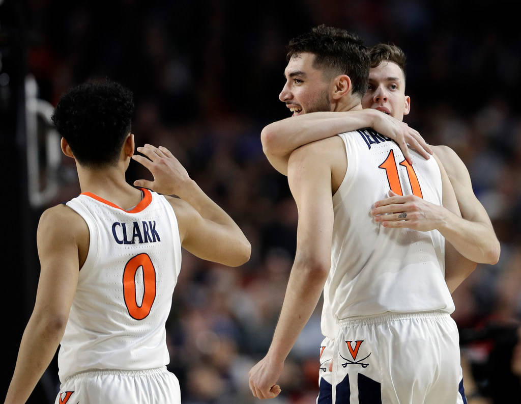 Virginia's Kihei Clark (0), Ty Jerome (11) and Kyle Guy react during the second half in the sem ...