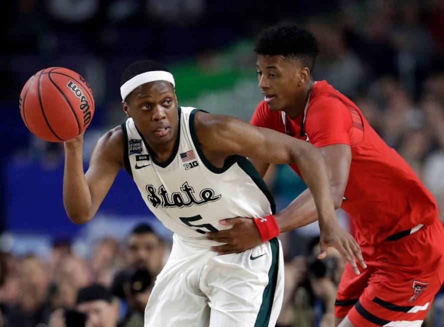 Michigan State's Cassius Winston (5) drives against Texas Tech's Jarrett Culver during the seco ...