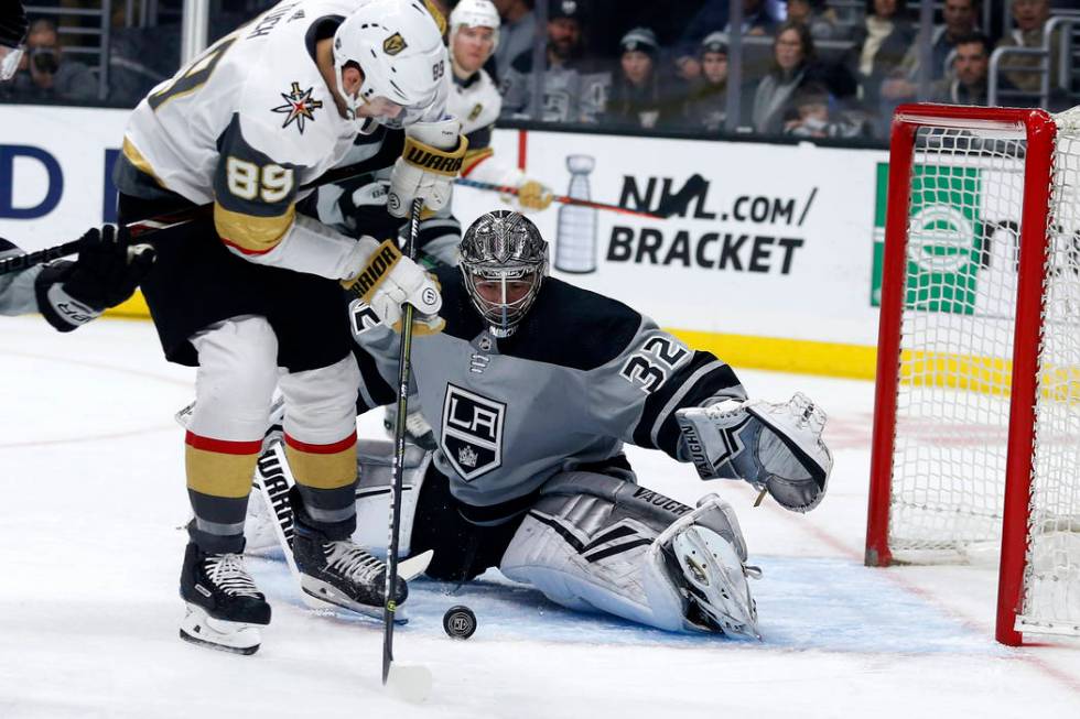 Los Angeles Kings goalie Jonathan Quick (32) stops a shot by Vegas Golden Knights forward Alex ...