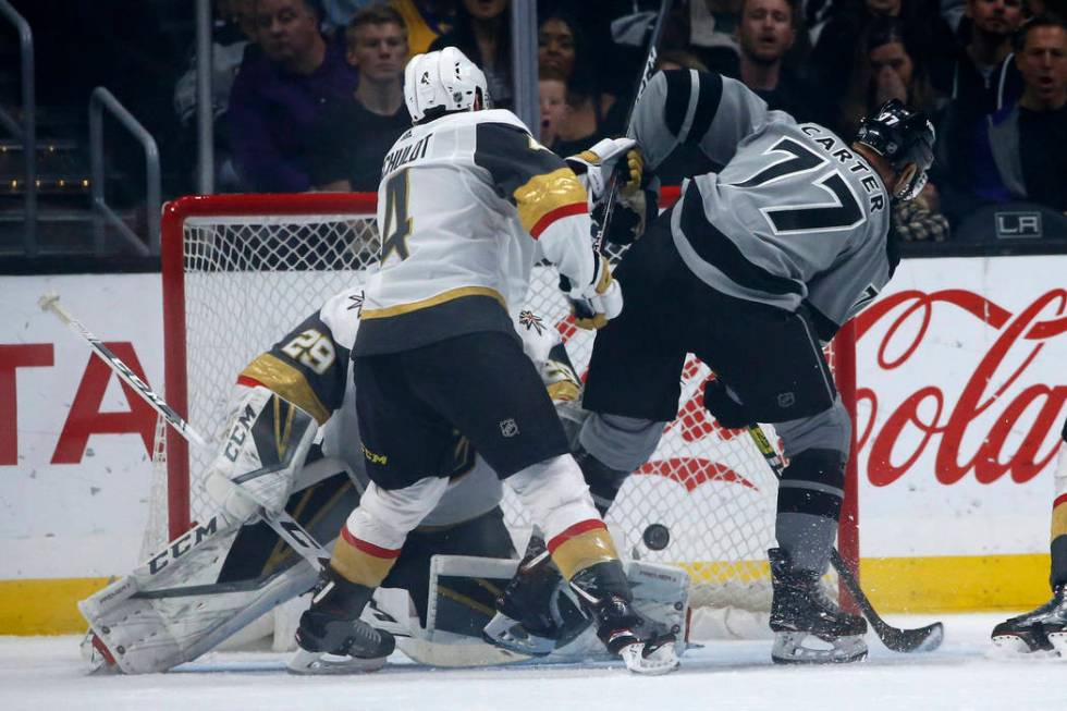 Los Angeles Kings forward Jeff Carter (77) scores on Vegas Golden Knights goalie Marc-Andre Fle ...