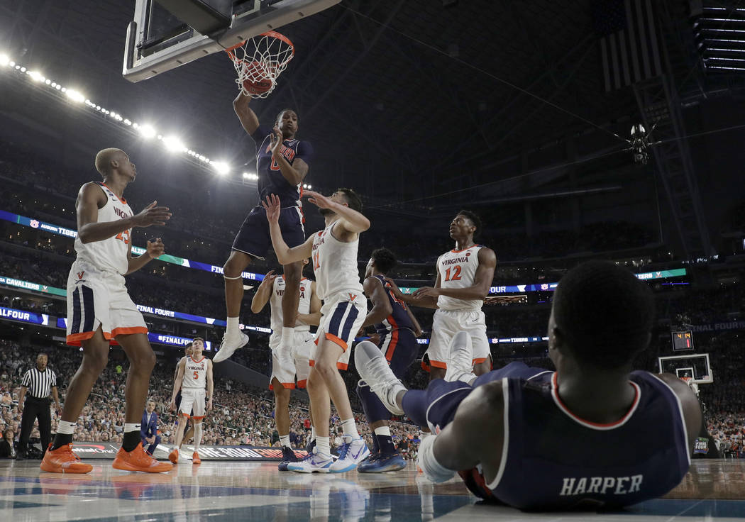 Auburn's Horace Spencer (0) dunks during the first half in the semifinals of the Final Four NCA ...