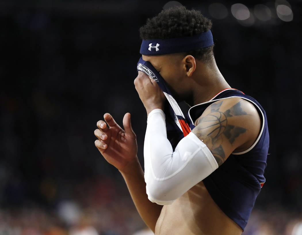 Auburn guard Bryce Brown reacts at the end of a semifinal round game against Virginia in the Fi ...