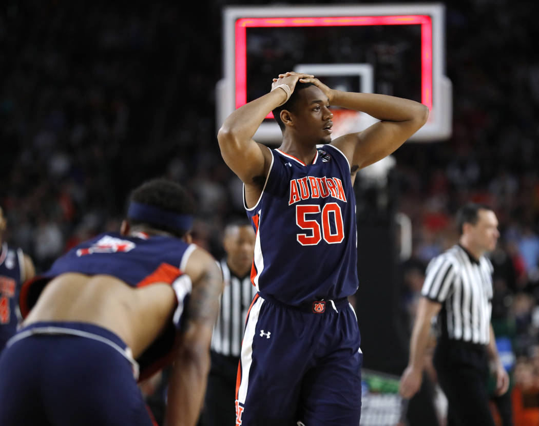 Auburn center Austin Wiley reacts at the end of a semifinal round game against Virginia in the ...