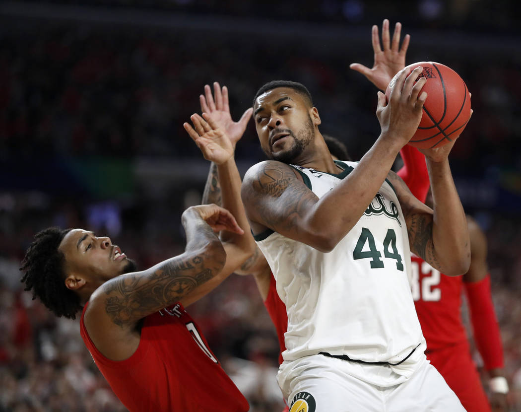 Michigan State's Nick Ward (44) drives against Texas Tech's Kyler Edwards (0) during the second ...