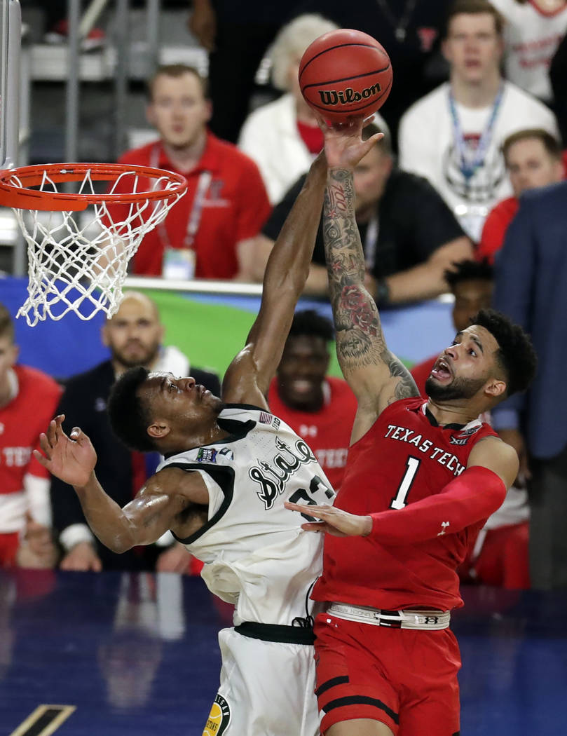 Texas Tech's Brandone Francis (1) shoots over Michigan State's Xavier Tillman (23) during the s ...