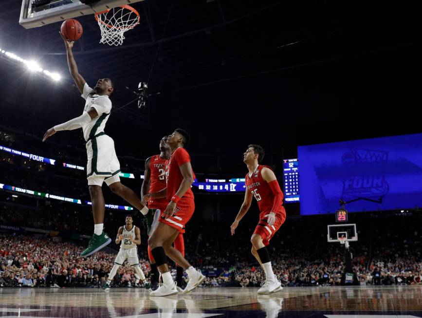 Michigan State's Aaron Henry (11) goes up for a basket during the second half in the semifinals ...