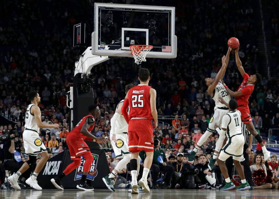 Texas Tech's Jarrett Culver takes a shot against Michigan State's Xavier Tillman (23) during th ...