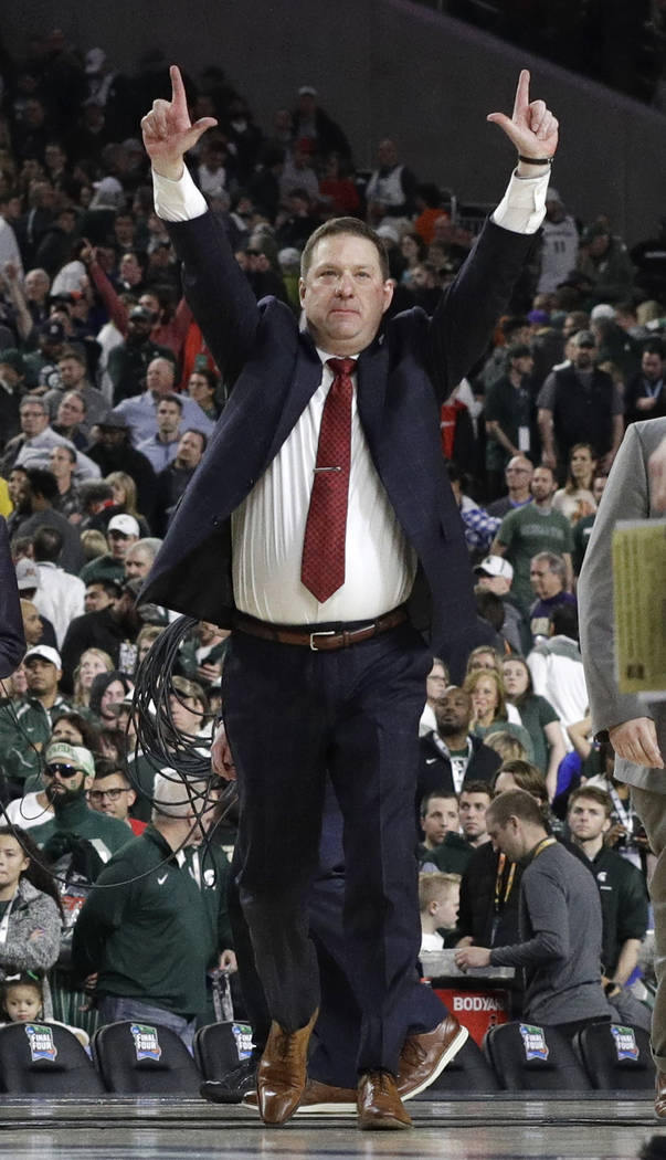 Texas Tech head coach Chris Beard celebrates at the end of a semifinal round game against Michi ...