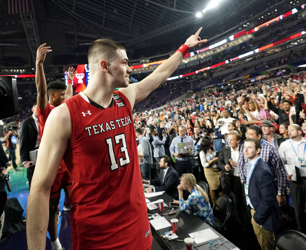 Texas Tech guard Matt Mooney reacts to fans after a semifinal round game against Michigan State ...