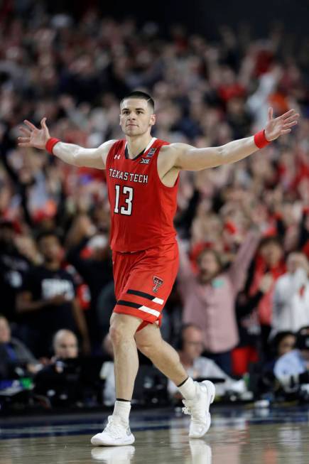 Texas Tech guard Matt Mooney celebrates after making a three-point basket during the second hal ...