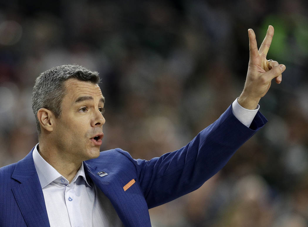 Virginia head coach Tony Bennett directs his team during the first half in the semifinals of th ...