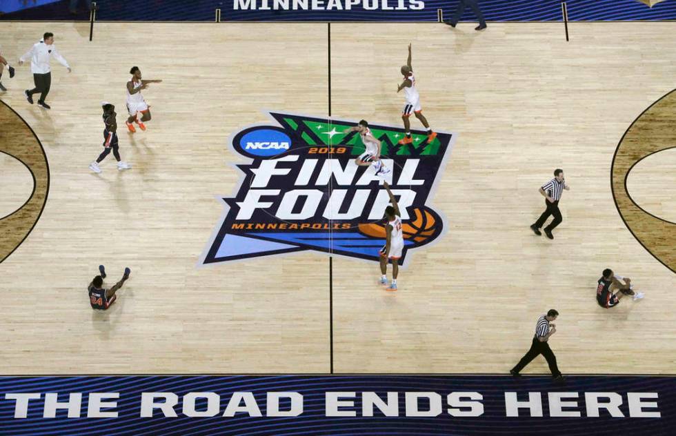 Virginia players celebrate after defeating Auburn 63-62 in the semifinals of the Final Four NCA ...