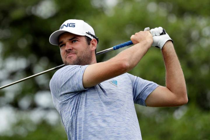 Corey Conners watches his drive on the second hole during the final round of the Texas Open gol ...