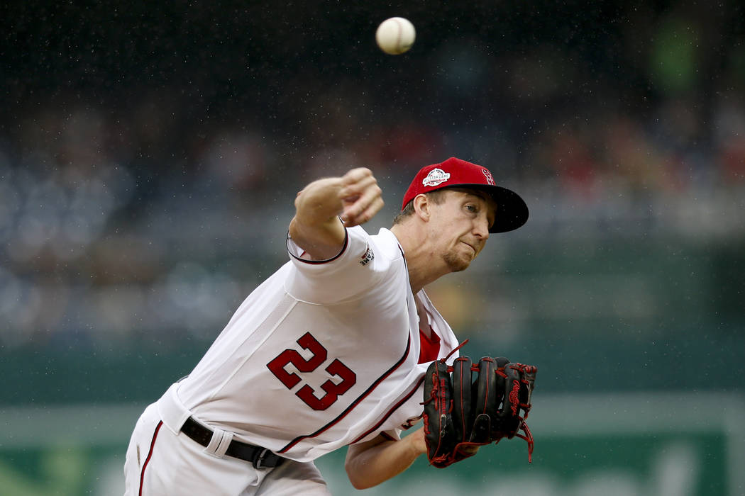 Washington Nationals pitcher Erick Fedde pitches in the first inning of a baseball game against ...