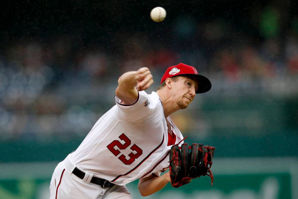 Washington Nationals pitcher Erick Fedde pitches in the first inning of a baseball game against ...