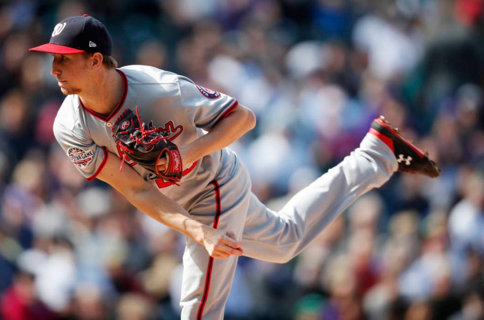 Washington Nationals relief pitcher Erick Fedde works against the Colorado Rockies in the first ...