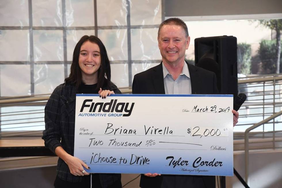 West Career and Technical Academy graduating senior Briana Virella is seen receiving a check fo ...