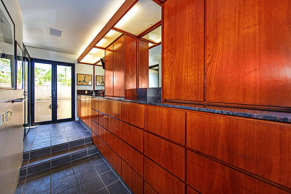 Teak cabinetry lines the hallway. (Luxury Estates International)