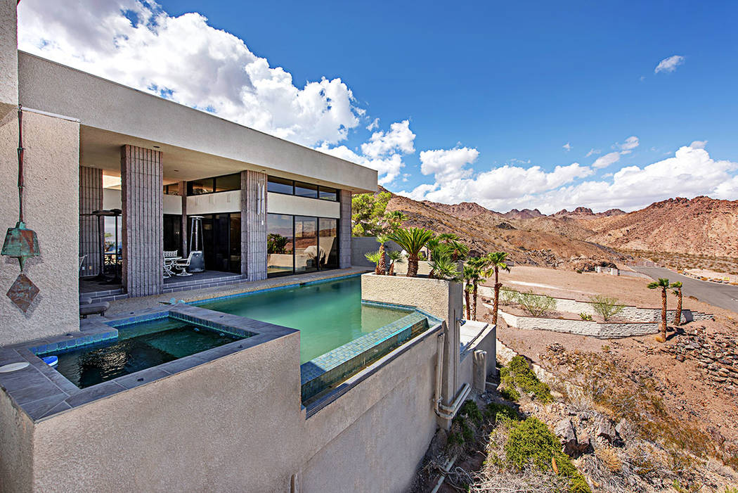 A 30-foot mountain wall on the west side of the property is a reminder of the challenging const ...