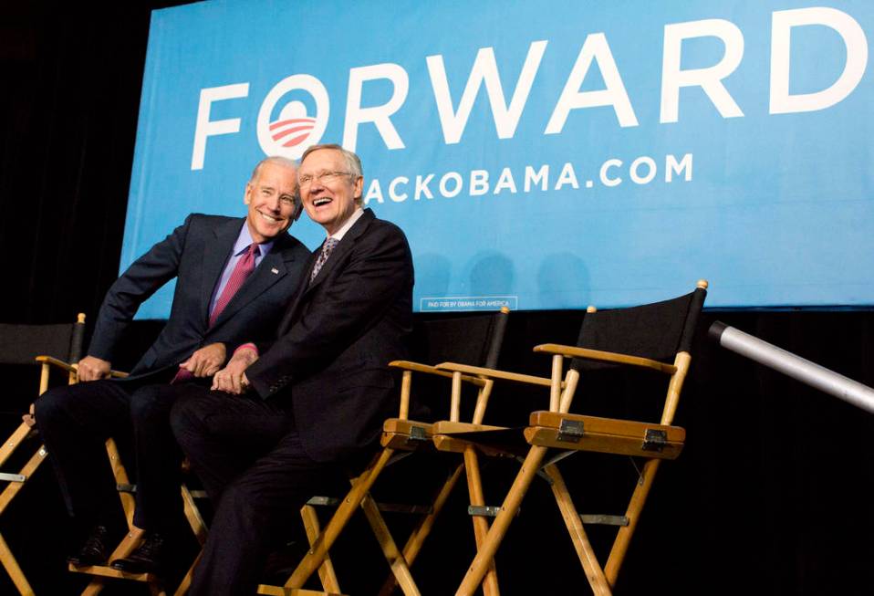 Vice president Joe Biden, left, and Senate Majority Leader Harry Reid of Nev. react to cheers f ...