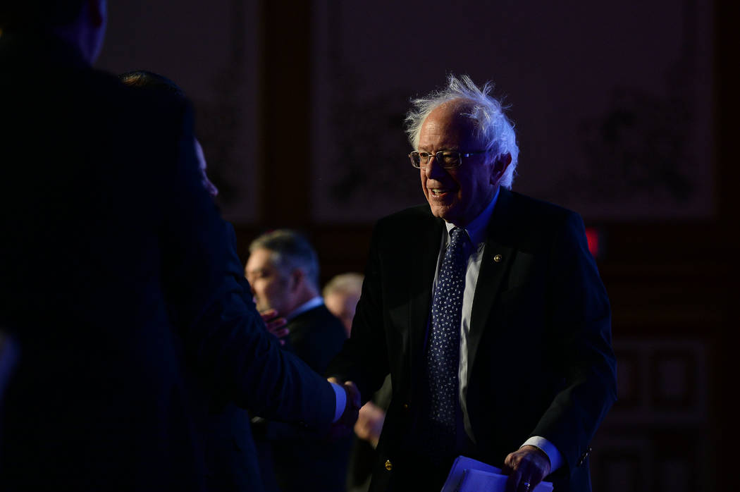 Democratic presidential candidate Sen. Bernie Sanders, I-Vt., greets people on stage before spe ...