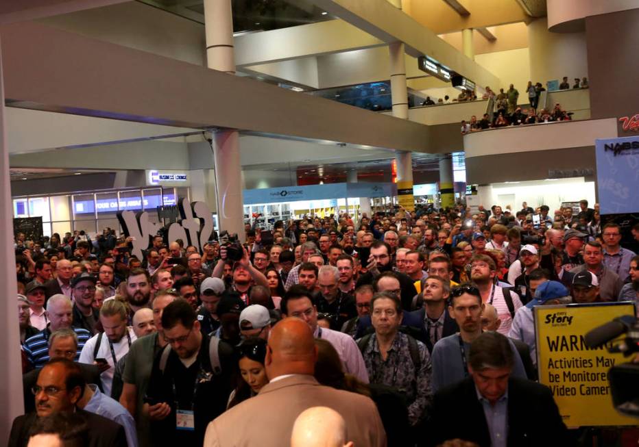 Conventioneers pour onto the show floor on the opening day of the National Association of Broad ...