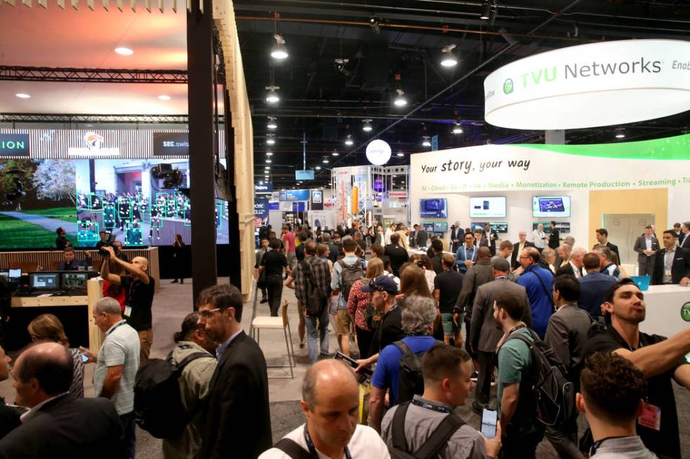 Conventioneers pour onto the show floor on the opening day of the National Association of Broad ...