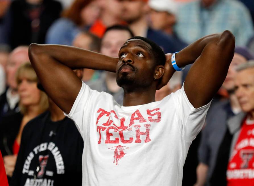 A Texas Tech fan reacts during the second half in the championship of the Final Four NCAA colle ...