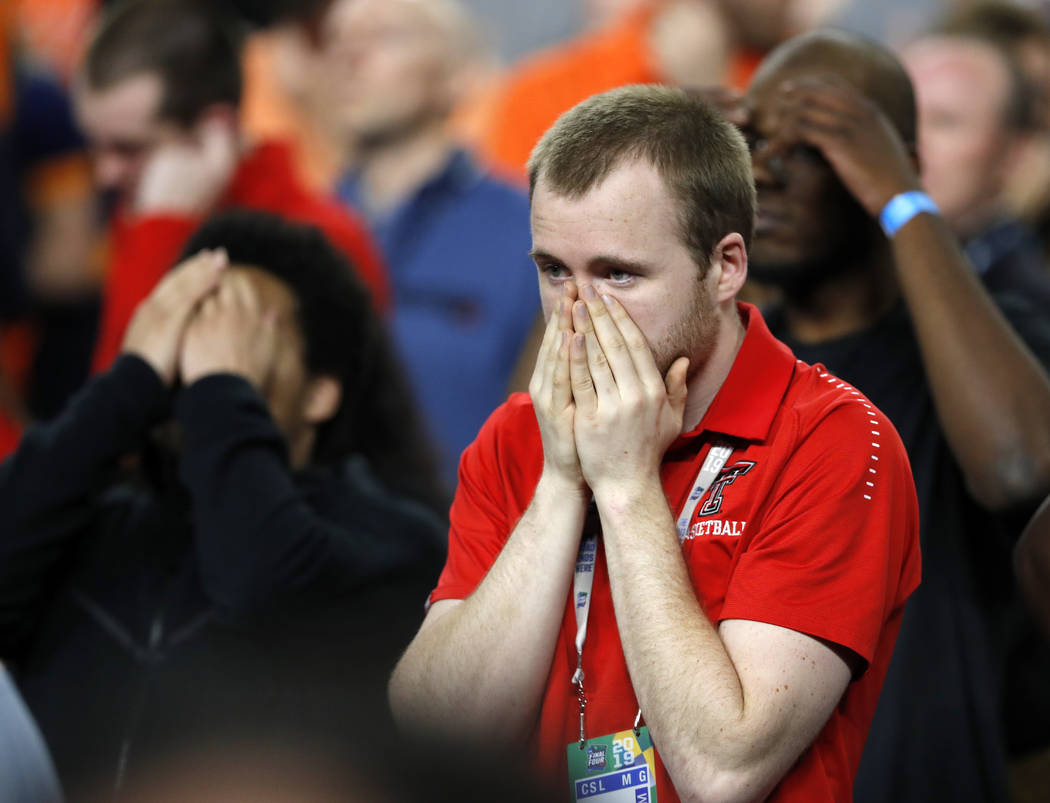 Texas Tech fans react during the second half in the championship of the Final Four NCAA college ...