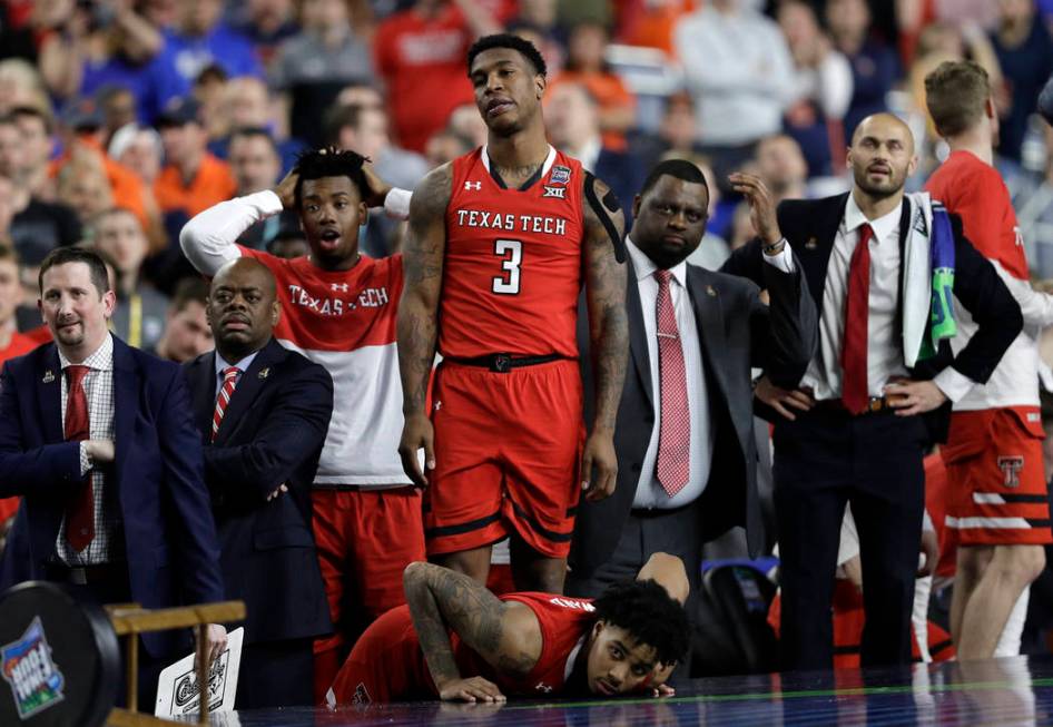 Texas Tech players react during the overtime in the championship of the Final Four NCAA college ...