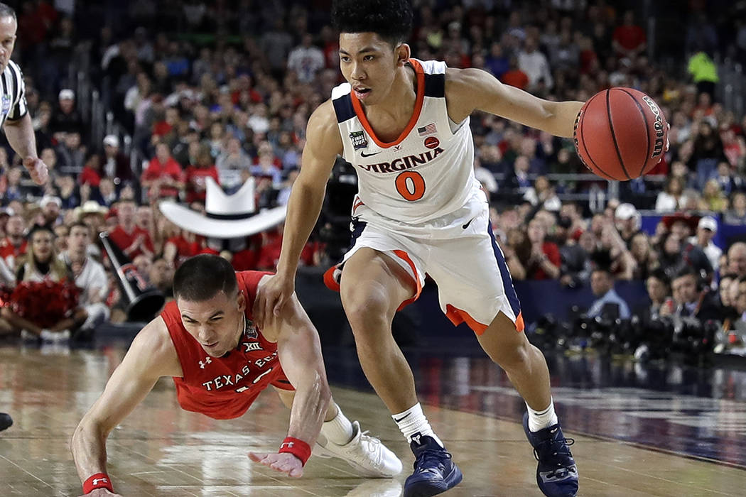 Virginia's Braxton Key (2) blocks a shot by Texas Tech's Jarrett Culver (23) during the second ...