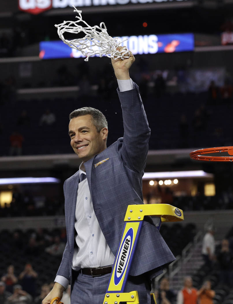 Virginia head coach Tony Bennett celebrates after cutting down the net following the championsh ...