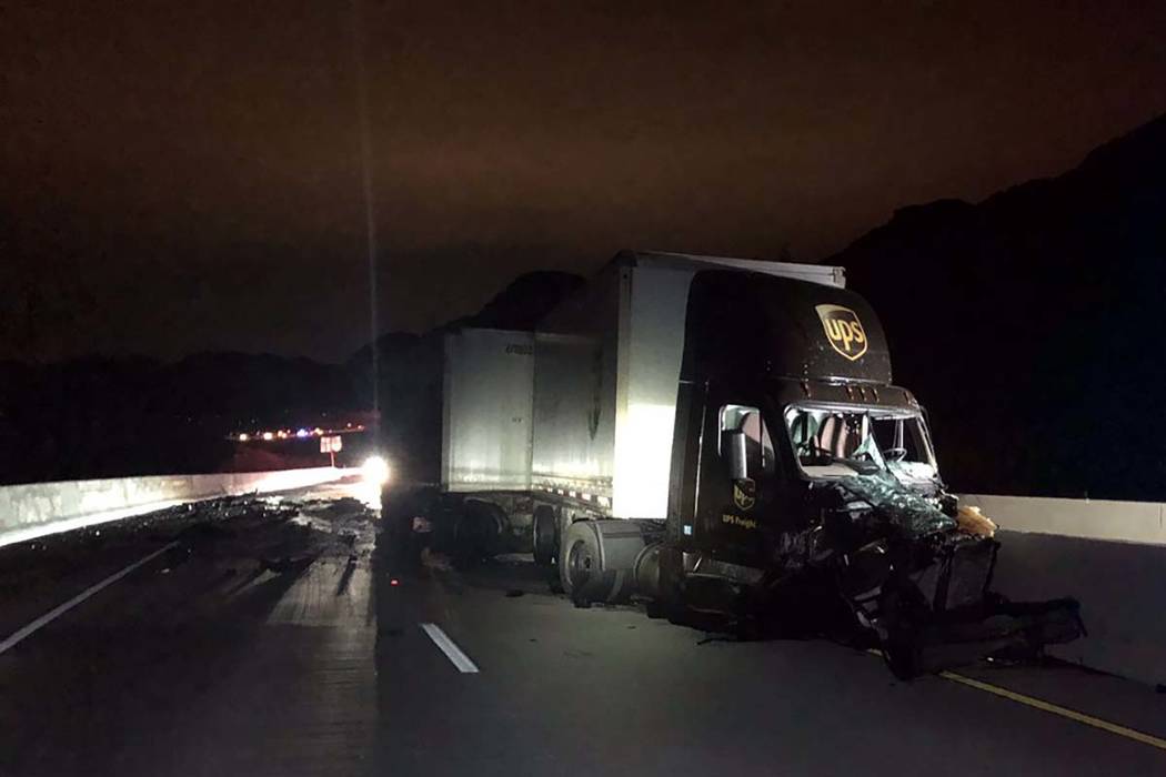 A UPS tractor-trailer sustained severe damage in a head-on crash with another vehicle near the ...