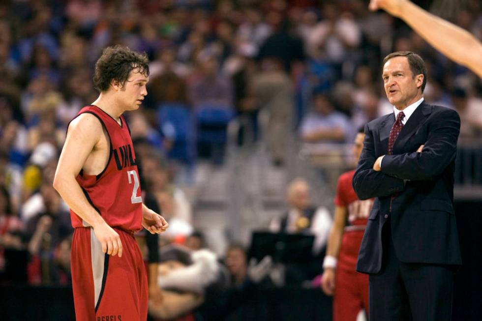 UNLV point guard Kevin Kruger looks to his father Lon Kruger as Oregon takes a free throw in th ...