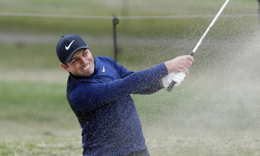 Francesco Molinari plays a shot from a bunker on the first hole during semifinal play against K ...