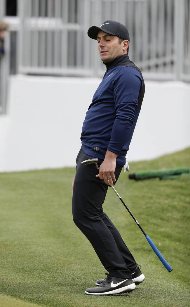 Francesco Molinari reacts to missing a putt on the 16th hole during semifinal play against Kevi ...